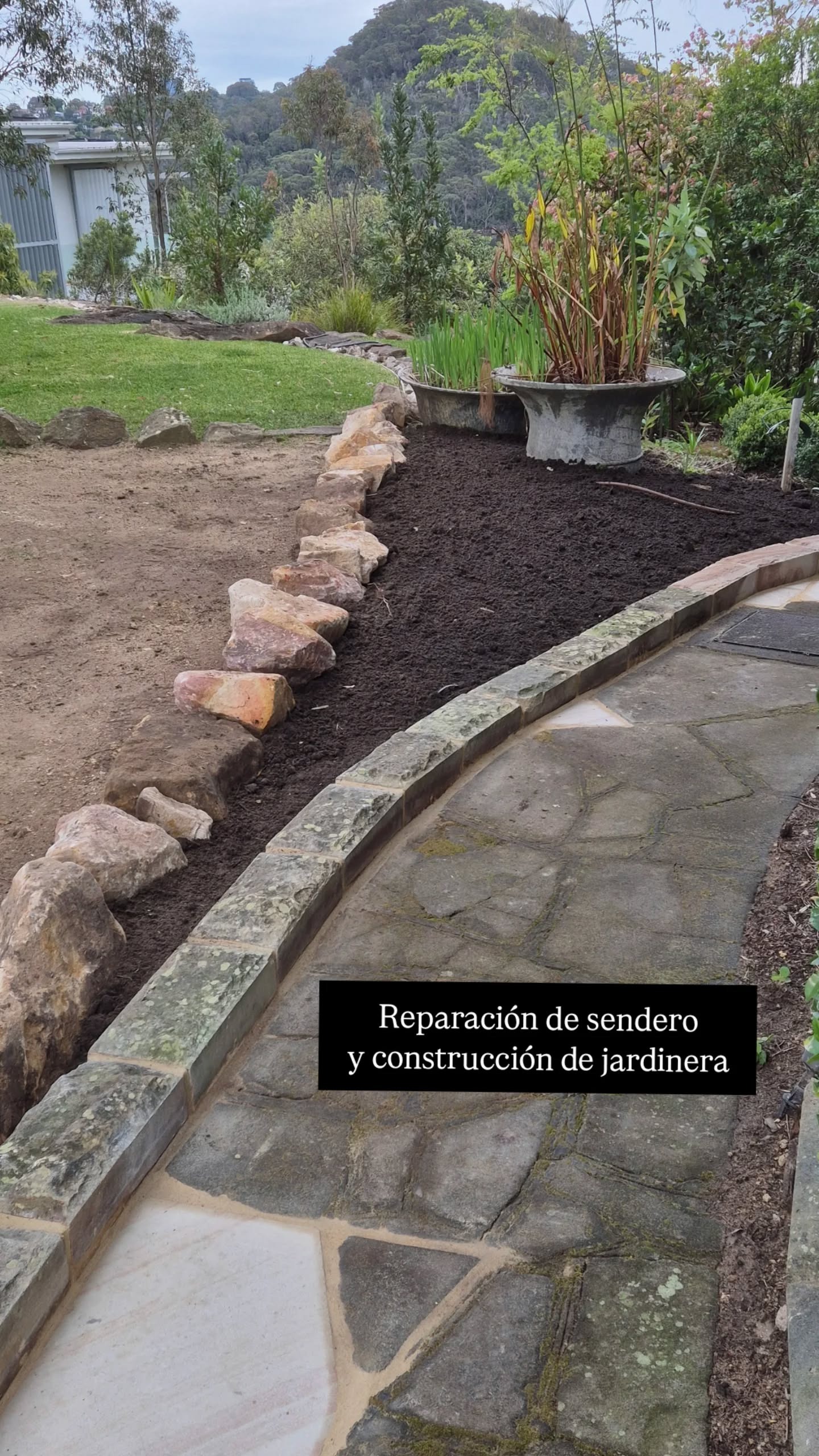 Reparación de sendero y construcción de jardinera con roca